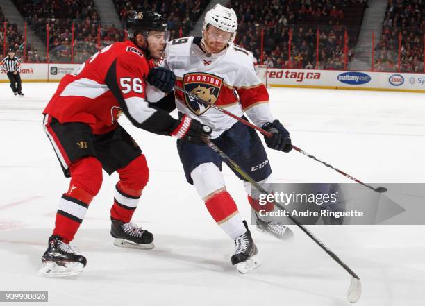Mike Matheson of the Florida Panthers fights off Magnus Paajarvi of the Ottawa Senators at Canadian Tire Centre on March 29, 2018 in Ottawa, Ontario,...