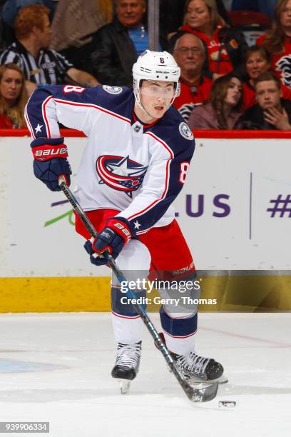 Zach Werenski of the Columbus Blue Jackets skates with the puck in an NHL game on March 29, 2018 at the Scotiabank Saddledome in Calgary, Alberta,...