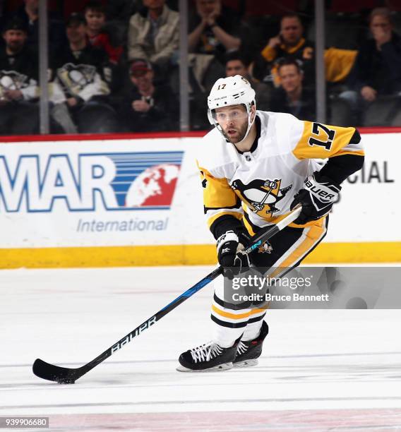 Bryan Rust of the Pittsburgh Penguins skates against the New Jersey Devils at the Prudential Center on March 29, 2018 in Newark, New Jersey. The...