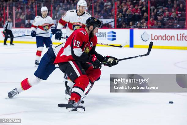 Ottawa Senators Center Zack Smith tries to recover the puck during overtime National Hockey League action between the Florida Panthers and Ottawa...