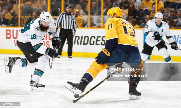 Nick Bonino of the Nashville Predators blocks a shot against Brent Burns of the San Jose Sharks during an NHL game at Bridgestone Arena on March 29,...