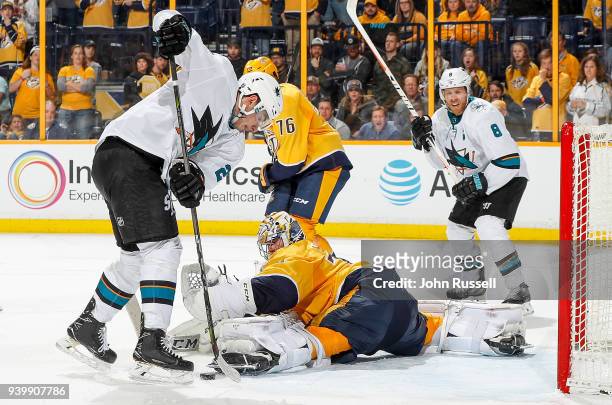 Juuse Saros of the Nashville Predators makes the save against Timo Meier of the San Jose Sharks during an NHL game at Bridgestone Arena on March 29,...