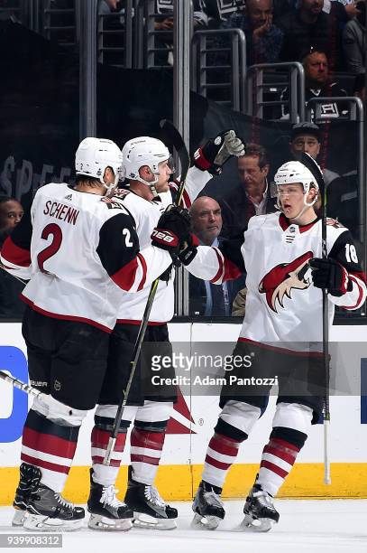 Kevin Connauton, Luke Schenn, and Christian Dvorak of the Arizona Coyotes celebrate Connauton's first period goal during the game against the Los...
