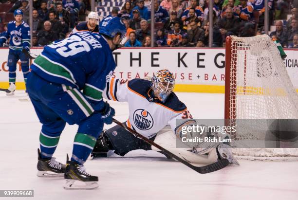 Sam Gagner of the Vancouver Canucks shoots the puck over the glove of goalie Cam Talbot of the Edmonton Oilers for a goal in NHL action on March 2018...