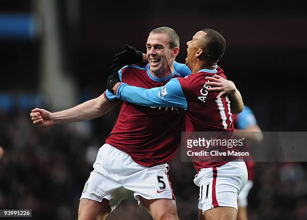 Richard Dunne and Gabriel Agbonlahor of Aston Villa celebrate after Richard Dunnes Gosl during the Barclays Premier League match between Aston Villa...
