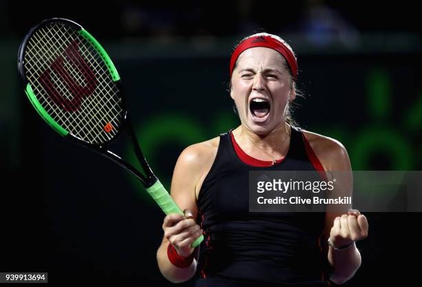 Jelena Ostapenko of Latvia celebrates match point against Danielle Collins of the United States in their semifinal during the Miami Open Presented by...