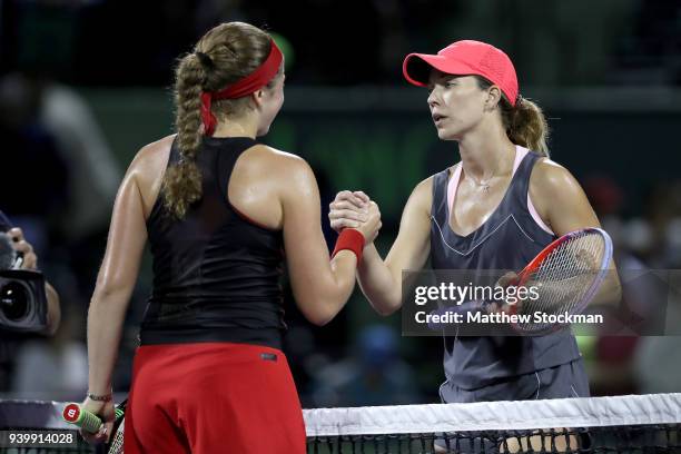 Jelena Ostapenko of Latvia is congratulated by Danielle Collins after their match during the semifinals of the Miami Open Presented by Itau at...