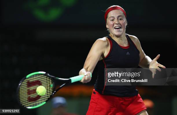 Jelena Ostapenko of Latvia plays a forehand against Danielle Collins of the United States in their semifinal during the Miami Open Presented by Itau...