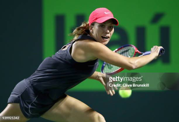 Danielle Collins of the United States plays a backhand against Jelena Ostapenko of Latvia in their semifinal during the Miami Open Presented by Itau...