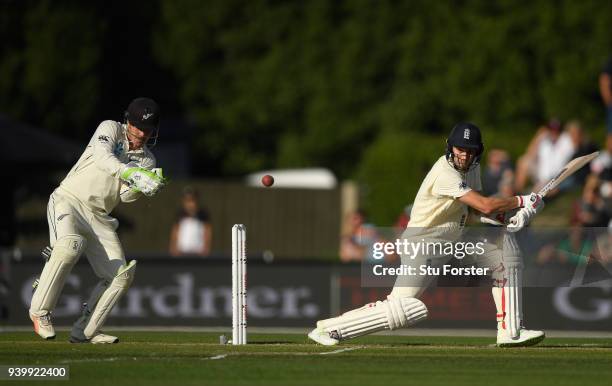 England batsman Mark Wood hits out watched by BJ Watling during day one of the Second Test Match between the New Zealand Black Caps and England at...