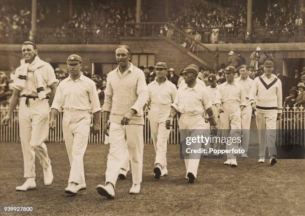 The England captain AER Gilligan leading his team onto the field at the start of the Australian 2nd innings during the 4th Test match between...