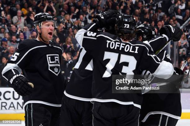 Christian Folin and Tyler Toffoli of the Los Angeles Kings celebrate a third period goal during the game against the Arizona Coyotes on March 29,...