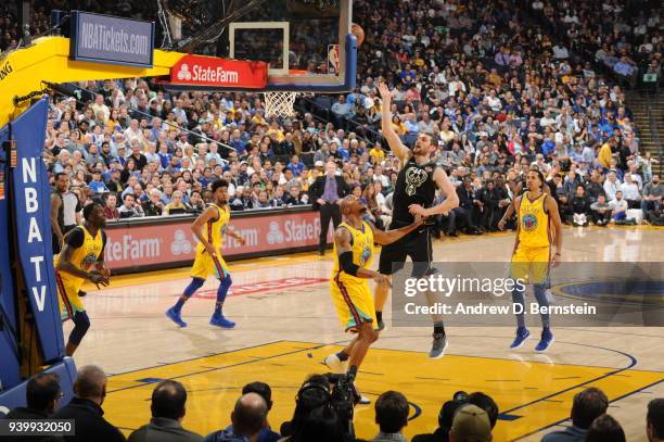 Tyler Zeller of the Milwaukee Bucks drives to the basket during the game against the Golden State Warriors on March 29, 2018 at ORACLE Arena in...