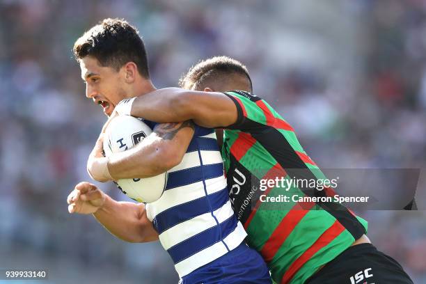 Jeremy Marshall-King of the Bulldogs is tackled during the round four AFL match between the South Sydney Rabbitohs and the Canterbury Bulldogs at ANZ...