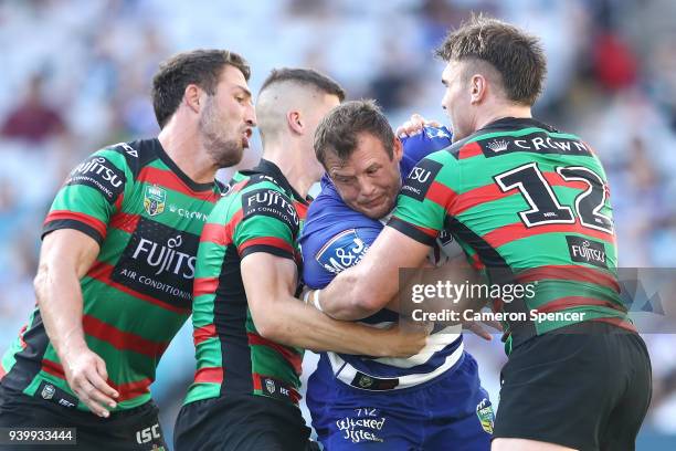 Brett Morris of the Bulldogs is tackled during the round four AFL match between the South Sydney Rabbitohs and the Canterbury Bulldogs at ANZ Stadium...