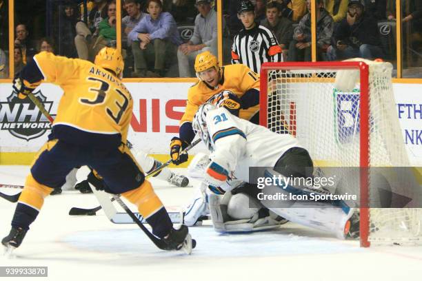 San Jose Sharks goalie Martin Jones defends against Nashville Predators right wing Craig Smith during the NHL game between the Nashville Predators...