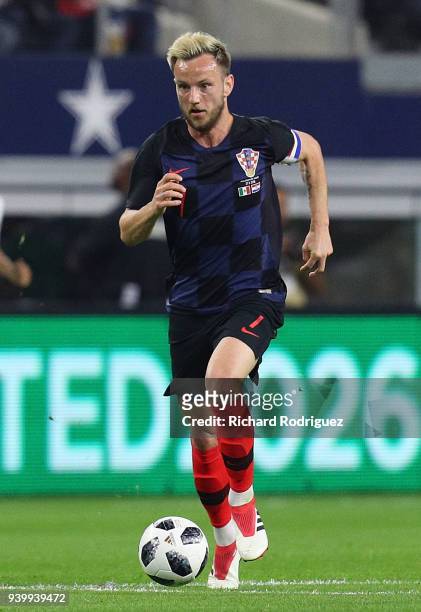 Ivan Rakitic of Croatia drives the ball down the field during an international friendly soccer match against Mexico at AT&T Stadium on March 27, 2018...