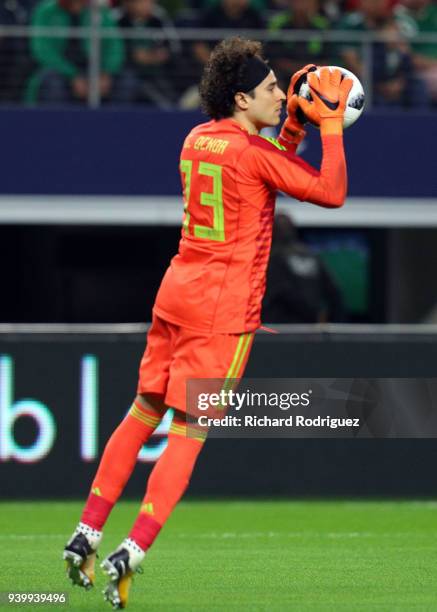 Guillermo Ochoa goalkeeper of Mexico blocks a shot on goal by Croatia during an international friendly soccer match at AT&T Stadium on March 27, 2018...