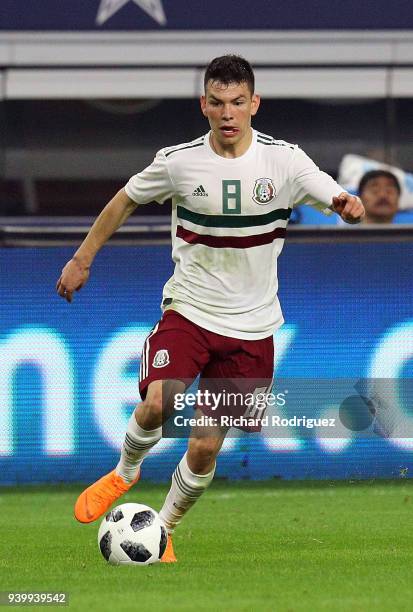 Hirving Lozano of Mexico drives the ball down the field during an international friendly soccer match against Croatia at AT&T Stadium on March 27,...