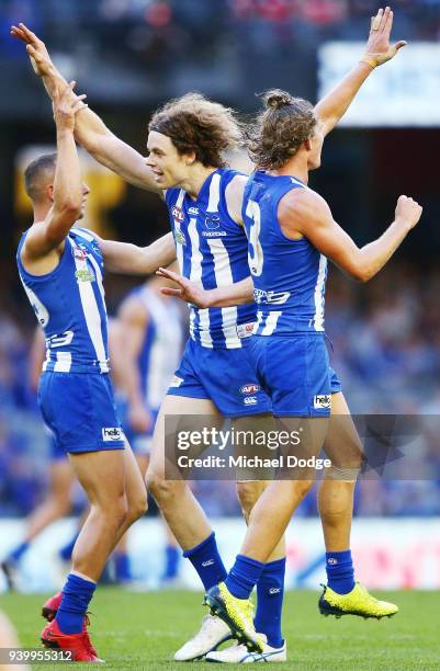 Ben Brown of the Kangaroos celebrates a goal during the round two AFL match between the North Melbourne Kangaroos and the St Kilda Saints at Etihad...