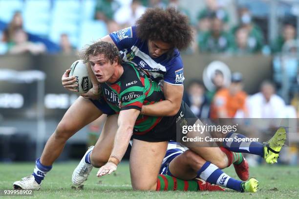 George Burgess of the Rabbitohs is tackled during the round four AFL match between the South Sydney Rabbitohs and the Canterbury Bulldogs at ANZ...