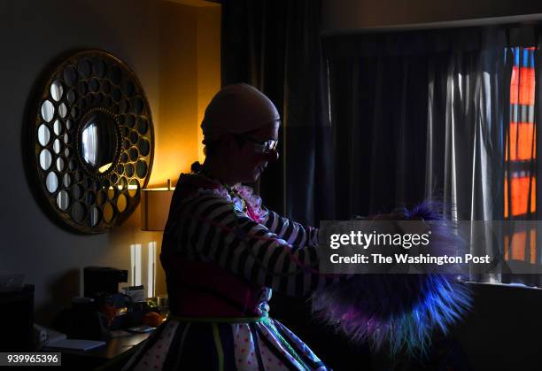 Tricia Manuel gets ready to don her wig in her room before heading to the ballroom to perform. Manuel was a longtime clown for the Ringling Bros. And...