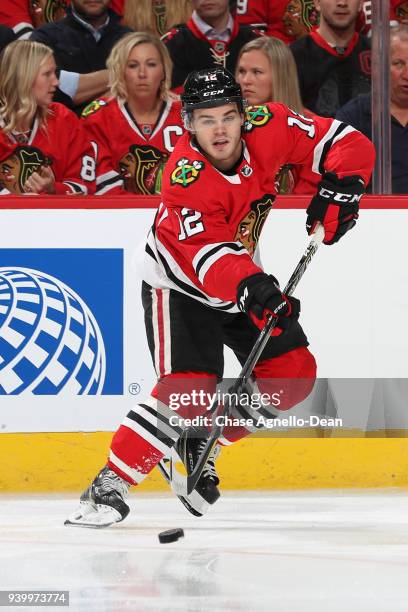 Alex DeBrincat of the Chicago Blackhawks receives the puck in the first period against the Colorado Avalanche at the United Center on March 6, 2018...