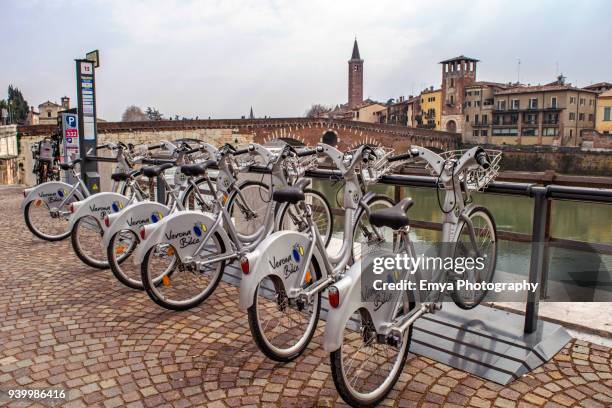 bikes in verona, italy - adige stock pictures, royalty-free photos & images