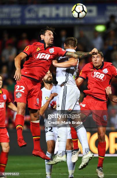 Ersan Gulum of Adelaide United heads a corner over the bar during the round 25 A-League match between Adelaide United and the Wellington Phoenix at...