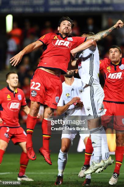 Ersan Gulum of Adelaide United heads a corner over the bar during the round 25 A-League match between Adelaide United and the Wellington Phoenix at...
