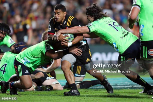 Chiefs Te Toiroa Tahuriorangi is tackled during the round seven Super Rugby match between the Chiefs and the Highlanders at FMG Stadium on March 30,...