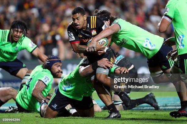 Chiefs Te Toiroa Tahuriorangi is tackled during the round seven Super Rugby match between the Chiefs and the Highlanders at FMG Stadium on March 30,...