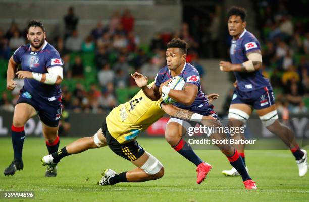 Will Genia of the Rebels runs with the ball during the round seven Super Rugby match between the Rebels and the Hurricanes at AAMI Park on March 30,...