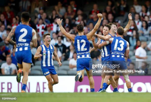 Ben Jacobs of the Kangaroos celebrates a goal during the 2018 AFL round 02 Good Friday Kick for the Kids match between the North Melbourne Kangaroos...