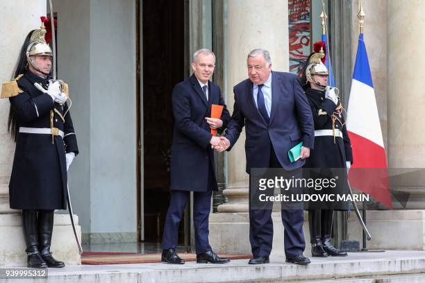 French National Assembly president, François de Rugy and French Senate president Gerard Larcher shake hands as they leave following a meeting with...