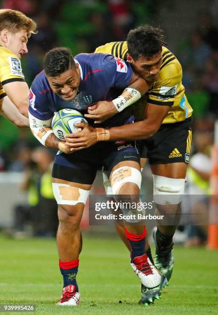 Amanaki Mafi of the Rebels runs with the ball during the round seven Super Rugby match between the Rebels and the Hurricanes at AAMI Park on March...