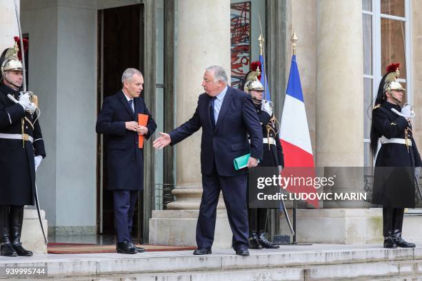 French National Assembly president, François de Rugy and French Senate president Gerard Larcher shake hands as they leave following a meeting with...