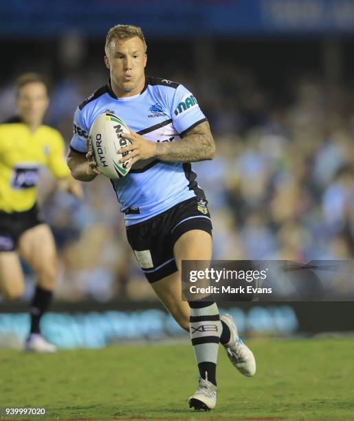 Trent Hodkinson of the Sharks runs with the ball during the round four NRL match between the Cronulla Sharks and the Melbourne Storm at Southern...