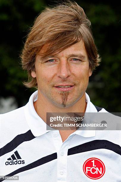 First division Bundesliga football club 1.FC Nuremberg's head coach Michael Oenning poses for photographers during the team presentation on July 8,...
