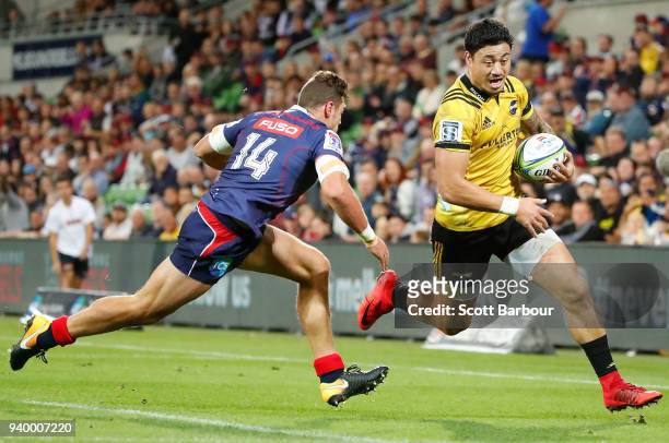 Ben Lam of the Hurricanes scores his fourth try during the round seven Super Rugby match between the Rebels and the Hurricanes at AAMI Park on March...
