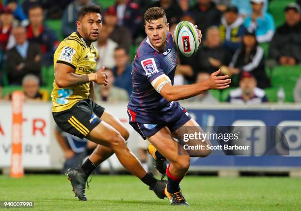 Tom English of the Rebels runs with the ball during the round seven Super Rugby match between the Rebels and the Hurricanes at AAMI Park on March 30,...