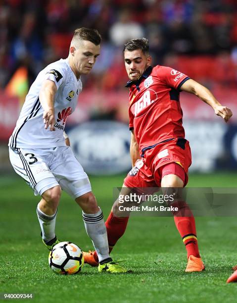 Scott Galloway of Wellington Phoenix and Ben Garuccio of Adelaide United during the round 25 A-League match between Adelaide United and the...