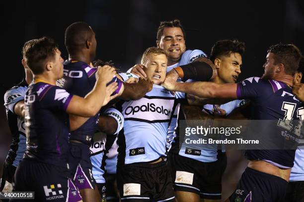 Trent Hodkinson of the Sharks , along with team mates is involved in a scuffle with Melbourne Storm players during the round four NRL match between...