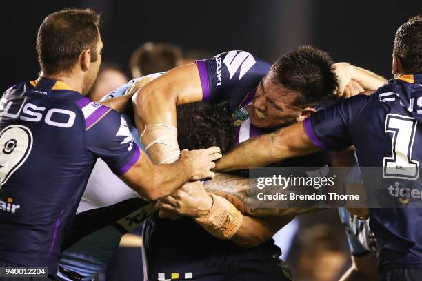 Andrew Fifita of the Sharks and Nelson Asofa-Solomona of the Storm engage in a scuffle during the round four NRL match between the Cronulla Sharks...