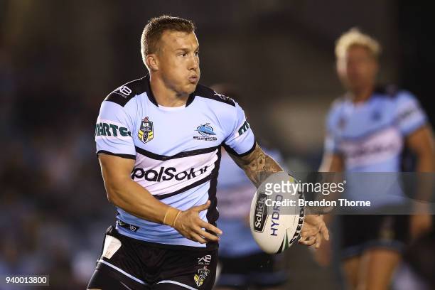 Trent Hodkinson of the Sharks passes the ball to a team mate during the round four NRL match between the Cronulla Sharks and the Melbourne Storm at...