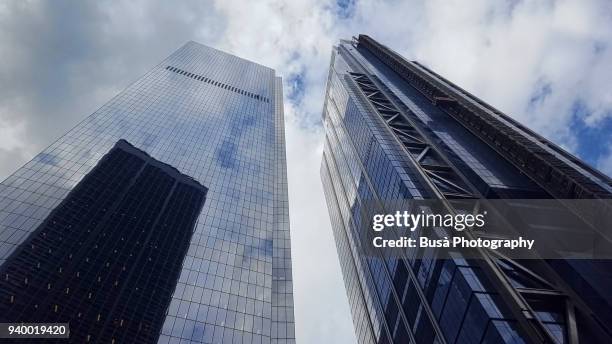 view from below of "3 world trade center" (right) and of another office tower at the world trade center site in lower manhattan, new york city - financial services stock pictures, royalty-free photos & images