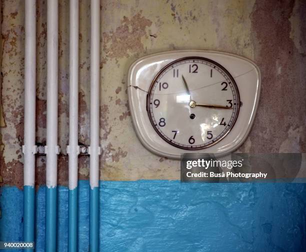 retro wall clock of the 1950s in domestic interior - wall clock stock pictures, royalty-free photos & images