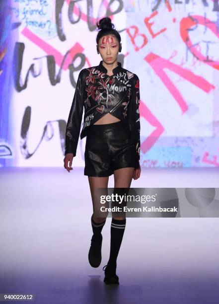 Model walks the runway for the Murat Aytulum show during Mercedes Benz Fashion Week Istanbul at Zorlu Performance Hall on March 30, 2018 in Istanbul,...