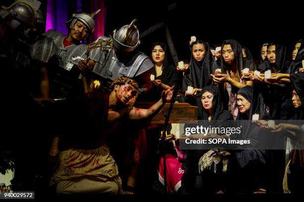 Roman soldiers whip an actor playing as Jesus Christ during the Senakulo in Manila. Members of the Sta. Ana drama club performed a passion play...