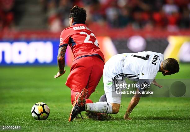 Ersan Gulum of Adelaide United collides with Nathan Burns of Wellington Phoenix during the round 25 A-League match between Adelaide United and the...